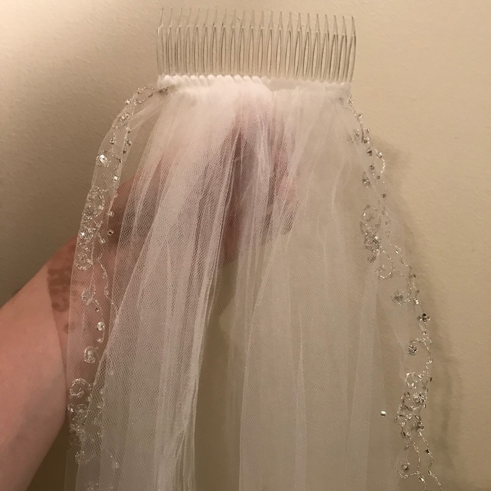 Long white veil with beading on edges